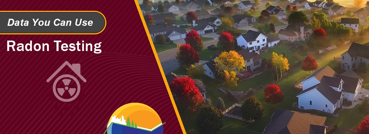 Overhead view of houses in a neighborhood at sunrise with text: 