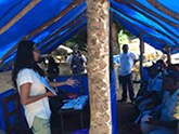 Dr. Rupa Narra (CDC; EIS 2014) teaches local healthcare workers basic Ebola infection control and prevention measures in a small border health post in Guinea, 2014. 