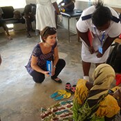 Katie Curran (EISO, WDPB) interviews a patient admitted in a Cholera Treatment Center in Dar es Salaam, during the 2015 – 2016 Tanzania cholera outbreak.