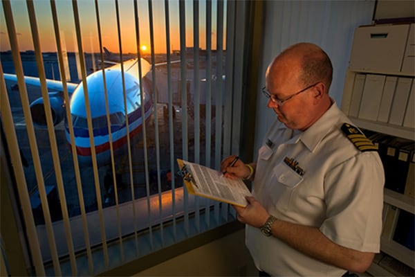 Quarantine officer at an airport reviewing data collected from an airline contact investigation. Image courtesy of Greg Knobloch.