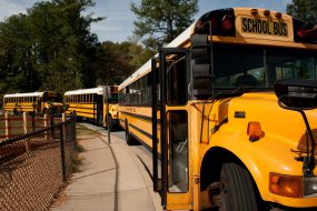 School buses waiting to take children home. When a flu pandemic occurs, public health officials may recommend nonpharmaceutical interventions such as temporary school dismissal.