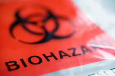 Close-up image of biohazard bag with the traditional red label