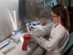  Jessica Pryor, microbiologist (IHRC), working in lab.