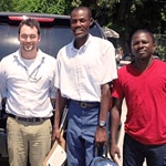 2 members of a rabies team in Haiti with a vet from CDC