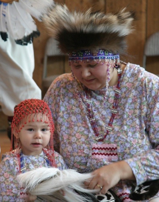 Native Alaskan residents with woman and her child