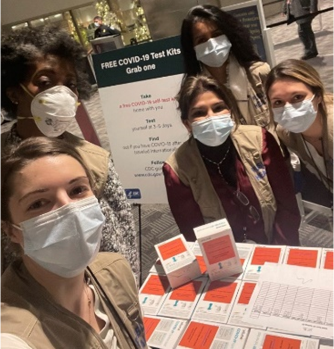 Women at the airport with COVID-19 Test kits