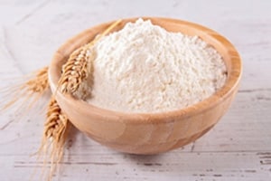 image of flour in a wooden bowl