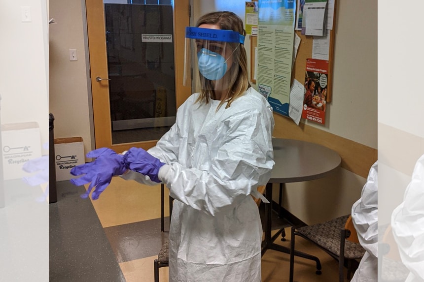 Anne Kimball (EIS 2019) gets her PPE set before heading in to swab patients