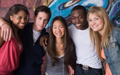 Photo of a smiling group of teenagers