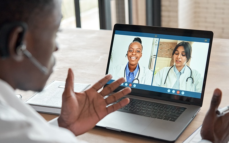 Multicultural doctors team conferencing in video call chat