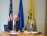 NIOSH Director, Dr. John Howard and ASSE President Terrie Norris, sign the agreement