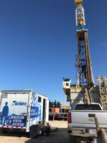 NIOSH researchers conduct hygiene research on an oil and gas well site. Photo by NIOSH