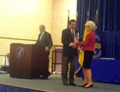 Tim receives his award from Secretary Sebelius