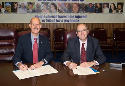 NIOSH Director Dr. John Howard and OSHA Assistant Secretary of Labor for Occupational Safety and Health Dr. David Michaels at the agreement signing. 