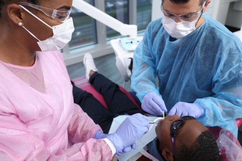 patient at dentist clinic gets dental treatment