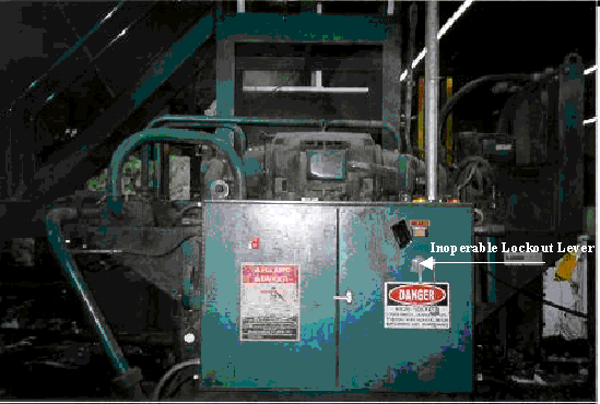 baler power panel, arrow points  to inoperable lockout lever