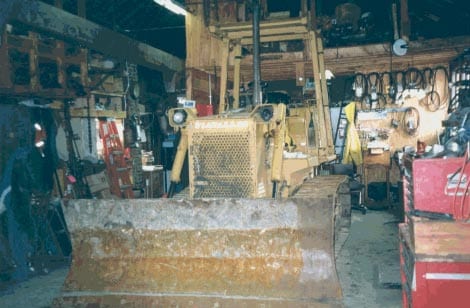 Figure 1 - Bulldozer involved in the incident, inside the blacksmith shop