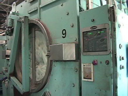 Exhibit #2. Front view of industrial washing machine and control panel