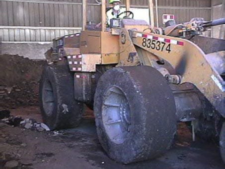 Exhibit #5. View of the right side of the front-end loader involved in the incident.