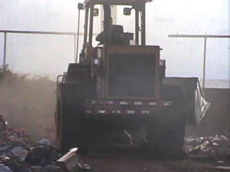 Exhibit #6. View of the front-end loader involved in the incident pushing waste.