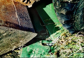 Photo 3 -- Tractor weights seen under the bucket