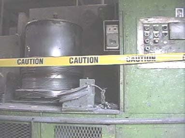 View of the rotating drum in proximity to the machine control panel.