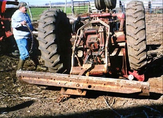 Photo 1 – Shot of the rear of the overturned tractor, facing north.