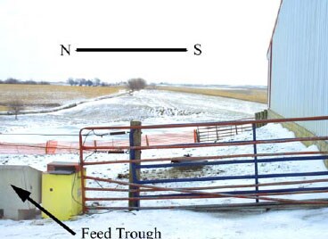 Photo 2 – Entry gate of feedlot facing East.