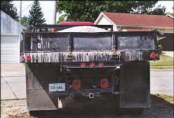 Photo 3 – View of rear of dump truck.