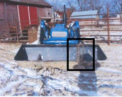 Figure 6. Moved tractor with bucket in semi-raised position and loose chain