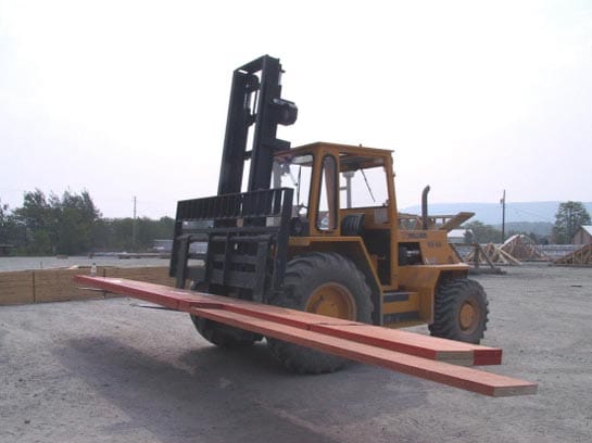 Photo 1.  An example of a forklift carrying a unit of laminated veneer beams.
