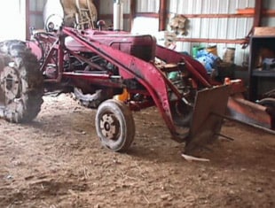 Figure 1. 1939 FarmAll Model M tractor with bale spike.  Photo taken after repairs and front-end conversion.