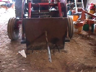 Figure 2. Front end-loader attachment and fabricated bale spear.