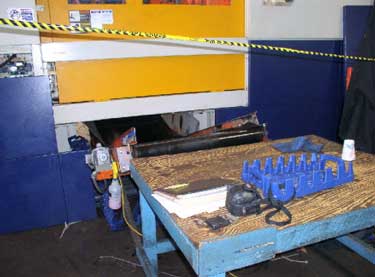 Exhibit #8. View of the victim’s work area on the back side of the injector mold.