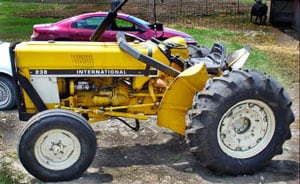 Photo 1 – Side view of tractor showing rollbar collapsed forward.