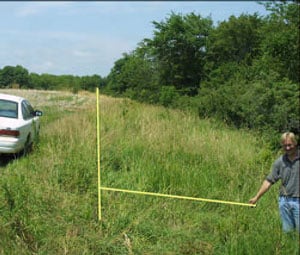 Photo 5 – Site of the overturn showing the location of the post and the downward ground slope of 8 degrees.
