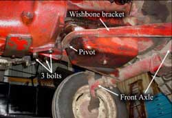 Photo 2 – Underside of tractor showing “wishbone” bracket and its attachment point, which was being repaired.