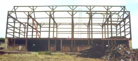 Photo 3 – View from the east of the barn showing the barn architecture and second pile of debris.
