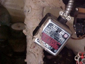 Figure 3. Low water switch box cover hanging from bracket