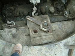 Photo 2. Top of Jaw Crusher Showing Toggle Block Retaining Clamp, Nut, and Wrench