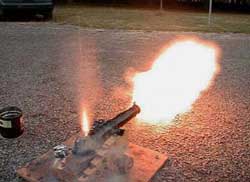 Photo 1. Black-powder salute (no projectile). Note flame from touch hole and muzzle.