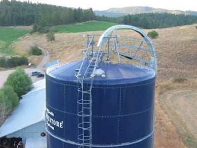 the top of the silo with ladder cage and chute extended after filling