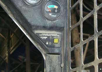 Figure 4. Button to control attachment operation hydraulics inside the operator's cab.