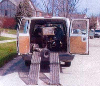 Figure 1. Van with sprayer and ramps leading to ground.