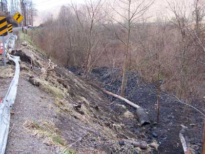 coal dumped at bottom of hillside