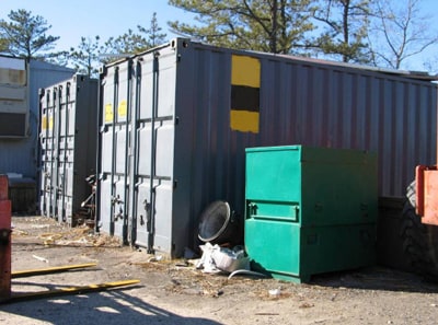 Incident location with similar metal storage containers.