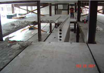 concrete slab wedged between steel beams
