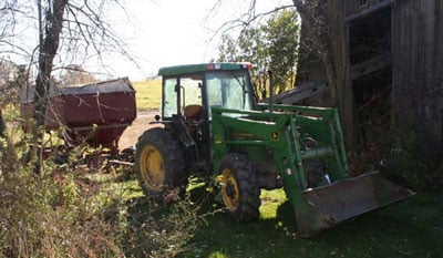 Positions of implement shed, elevator, gravity box and tractor.
