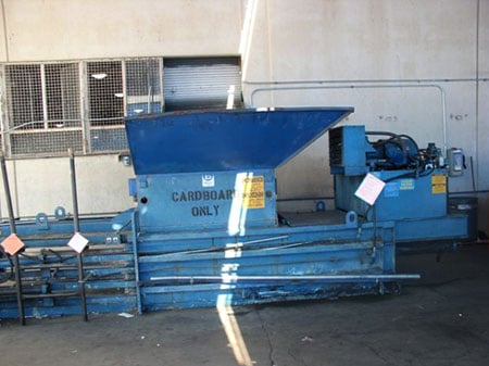The cardboard baler machine involved in the incident.