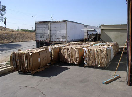 The bales of recycled cardboard produced by the machine involved in the incident.